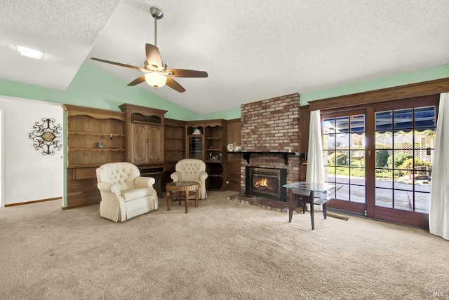 carpeted living room featuring baseboards, a brick fireplace, ceiling fan, a textured ceiling, and vaulted ceiling