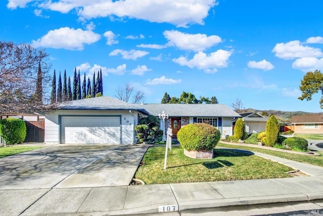 single story home with a garage and a front lawn