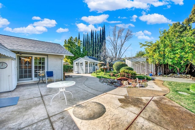 view of patio featuring a storage unit and a pergola