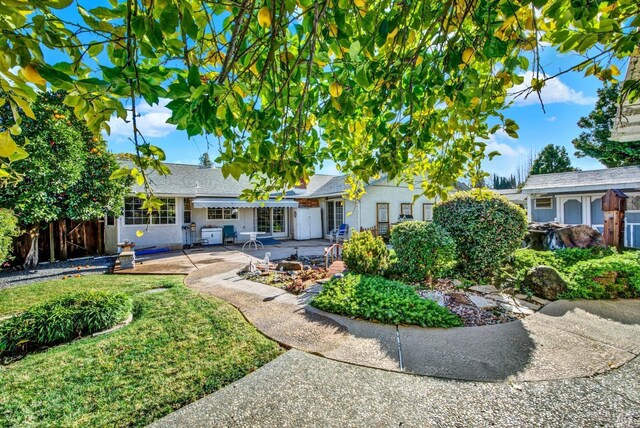 rear view of house with a patio