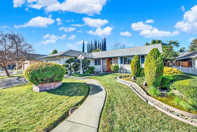 single story home featuring a front yard and fence