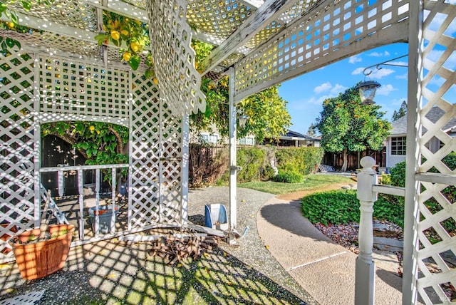 view of patio / terrace featuring fence and a pergola
