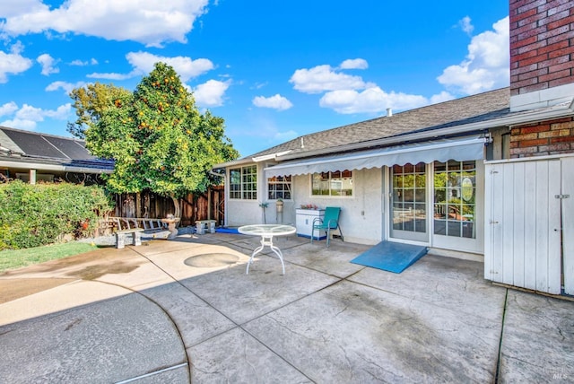 view of patio featuring fence