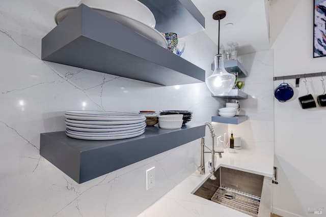 interior space featuring ventilation hood and a sink