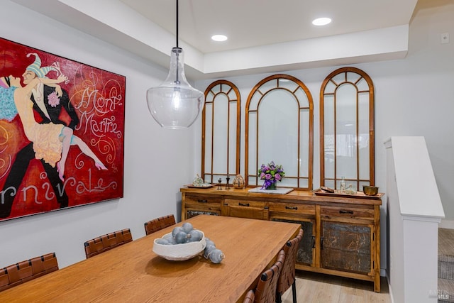 dining room with light wood-type flooring and recessed lighting