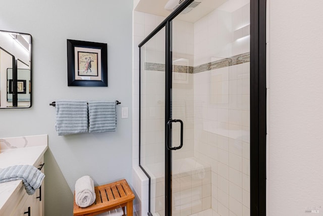 full bathroom with a stall shower and vanity