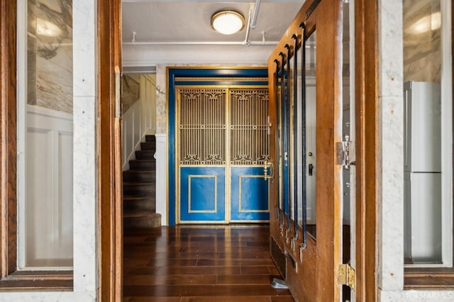 corridor featuring dark hardwood / wood-style flooring