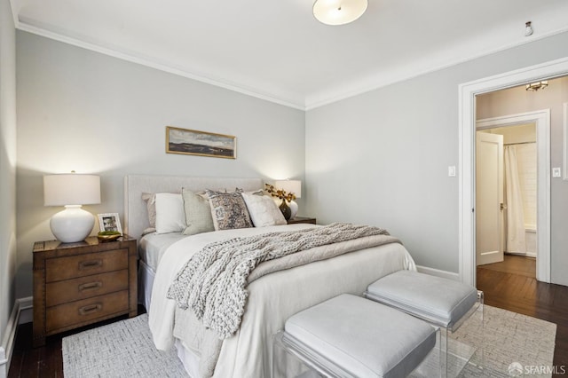 bedroom featuring ornamental molding and dark hardwood / wood-style floors