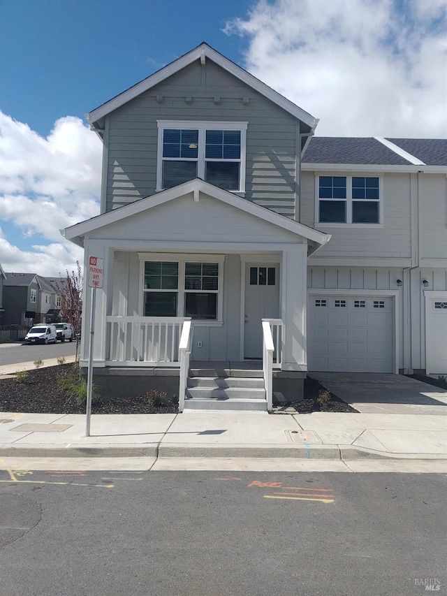 view of front of property with a garage and a porch