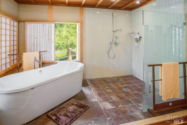 bathroom with separate shower and tub