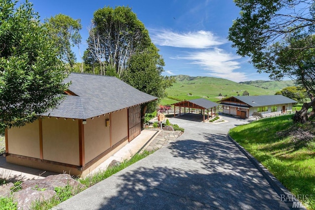 view of front of property featuring a carport and a mountain view