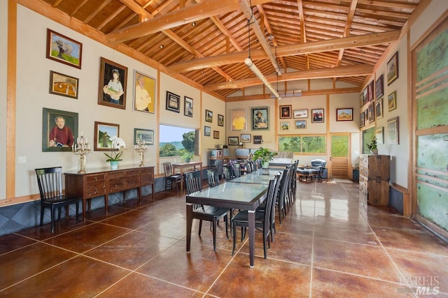 dining space with wood ceiling, high vaulted ceiling, and beamed ceiling