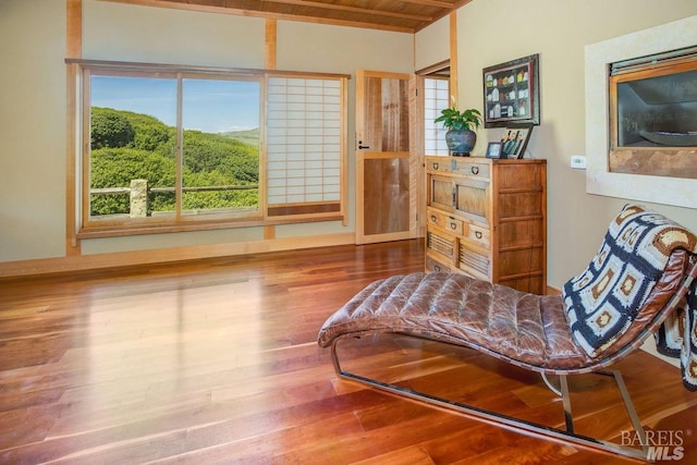 sitting room featuring hardwood / wood-style floors and wood ceiling