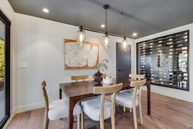 dining room with hardwood / wood-style flooring