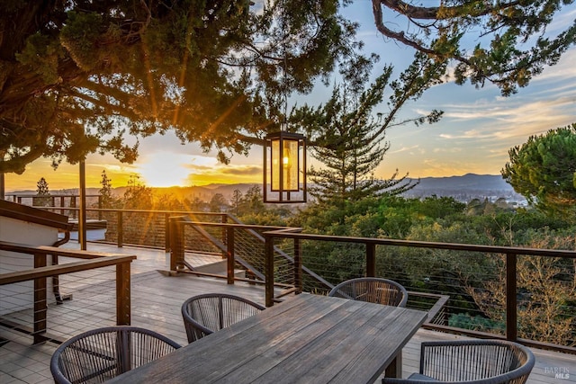 deck at dusk with a mountain view