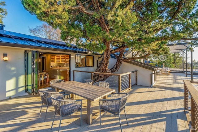 wooden terrace featuring a patio