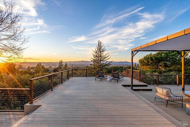 deck at dusk with a mountain view