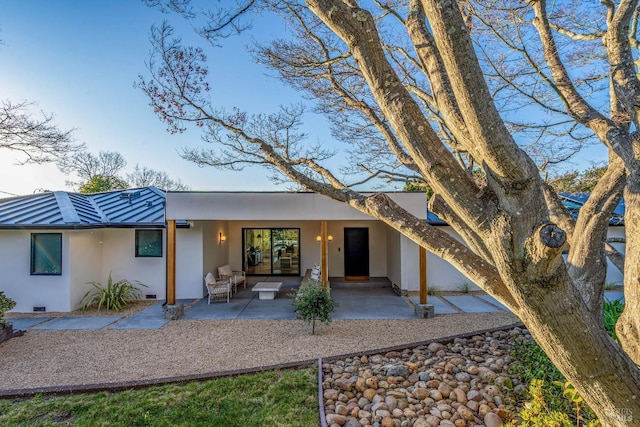 rear view of house featuring a patio