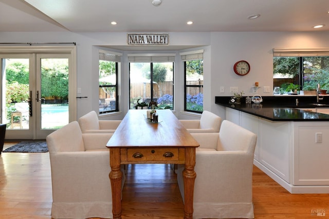 interior space featuring a wealth of natural light, french doors, recessed lighting, and light wood finished floors
