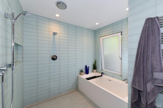 bathroom with tile walls, a tile shower, recessed lighting, a garden tub, and tile patterned flooring