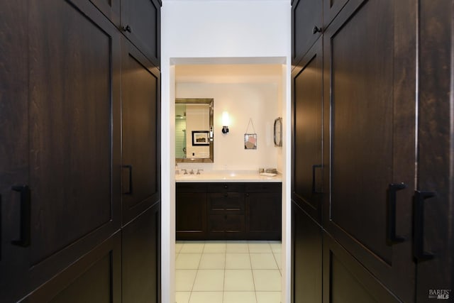 bathroom featuring tile patterned flooring and vanity
