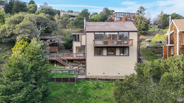 back of house with a balcony