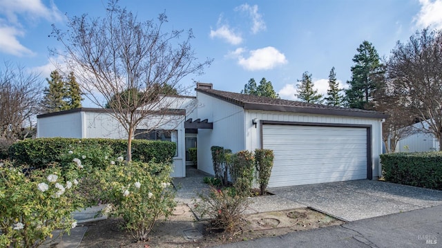 single story home featuring a garage