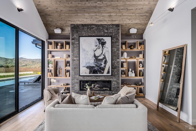 1212 Oak Knoll Ave, Napa, CA 94558 - living room with vaulted ceiling, wood ceiling, wood finished floors, a high end fireplace, and a mountain view