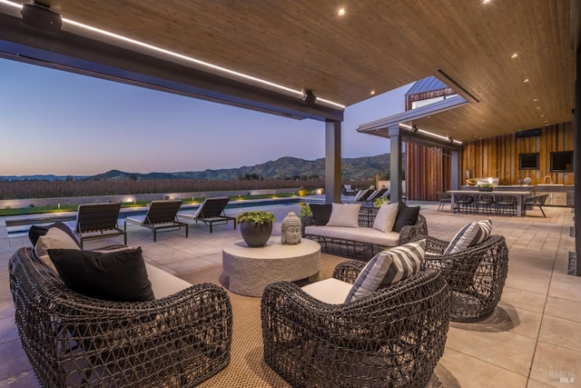 1212 Oak Knoll Ave, Napa, CA 94558 - patio terrace at dusk with a mountain view, a patio, an outdoor pool, and an outdoor living space