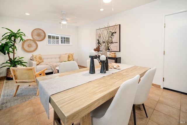 dining room featuring light tile patterned floors and ceiling fan