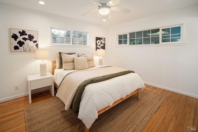 bedroom featuring hardwood / wood-style floors and ceiling fan