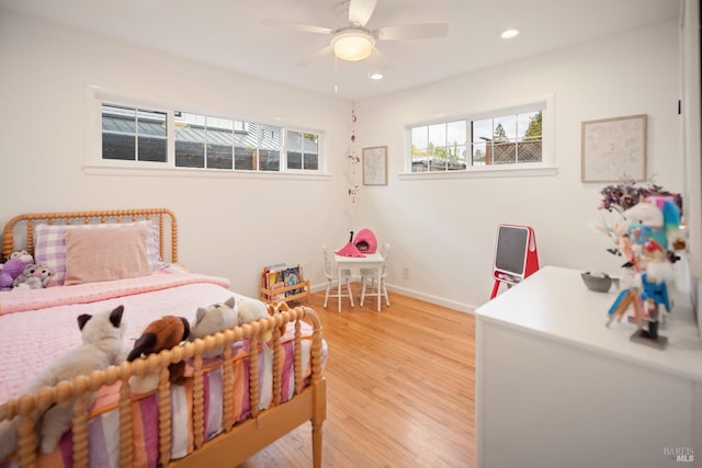 bedroom with wood-type flooring and ceiling fan