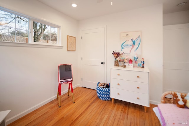 bedroom with light hardwood / wood-style flooring