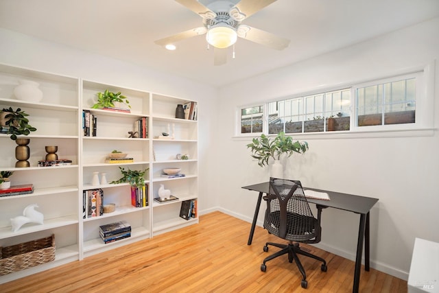 office featuring hardwood / wood-style flooring and ceiling fan