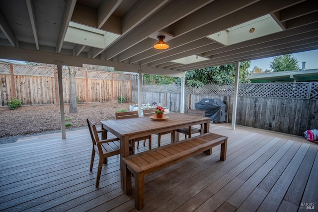 wooden deck with area for grilling