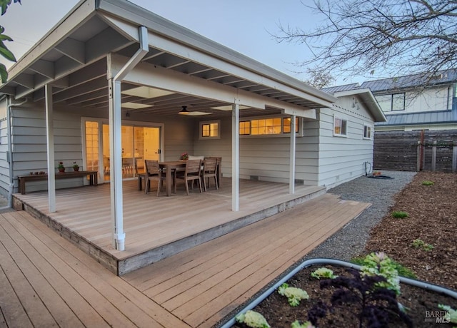 wooden terrace featuring ceiling fan