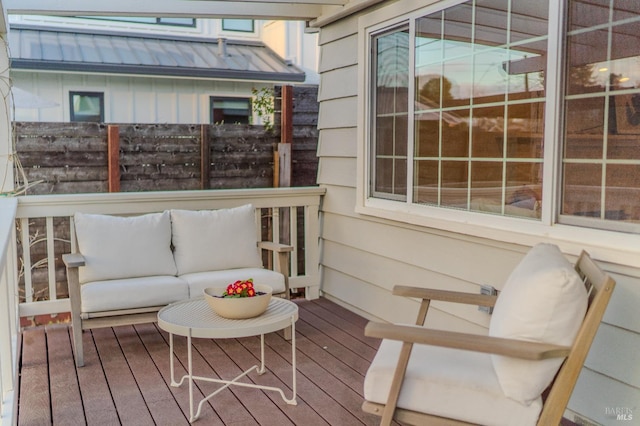 wooden deck featuring outdoor lounge area