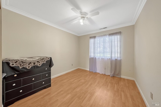 bedroom featuring ornamental molding, ceiling fan, and light wood-type flooring