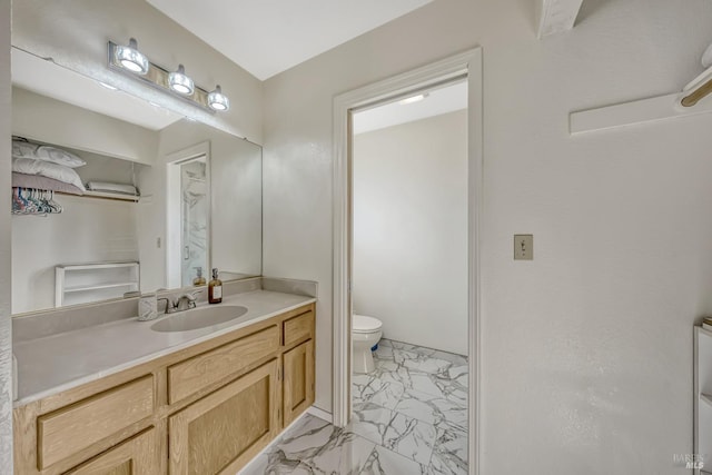 bathroom with vanity and toilet