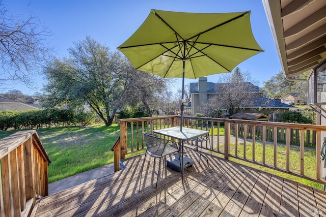 wooden deck with a yard