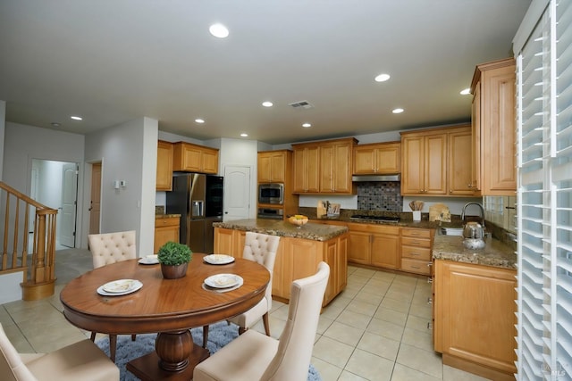 kitchen featuring stainless steel appliances, recessed lighting, and a sink