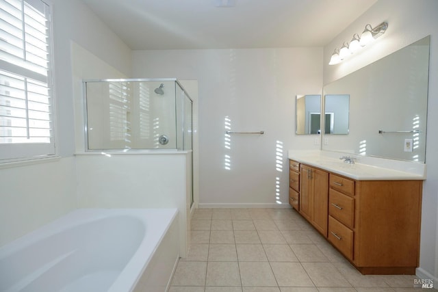 bathroom with tile patterned flooring, vanity, and separate shower and tub