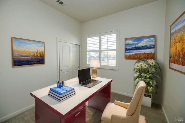 office space featuring baseboards, visible vents, and carpet flooring