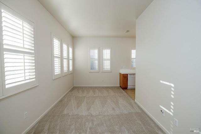 empty room with light colored carpet