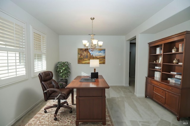 office featuring light carpet, a chandelier, and baseboards