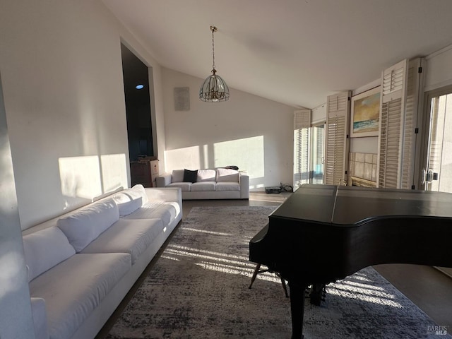 living room featuring vaulted ceiling