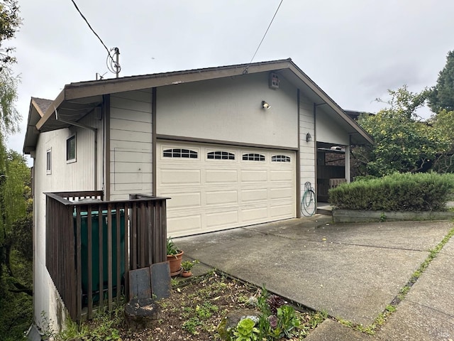 view of side of home with a garage