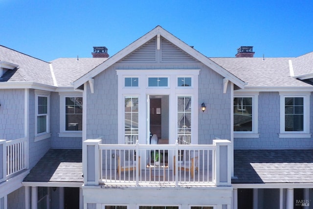 back of house with a balcony