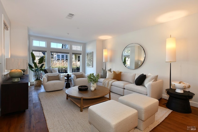 living room featuring dark wood-type flooring