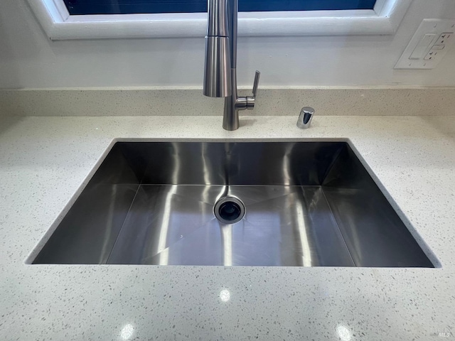 kitchen featuring white cabinetry, sink, stainless steel fridge, and dishwasher